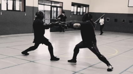 Momento de un combate de esgrima
